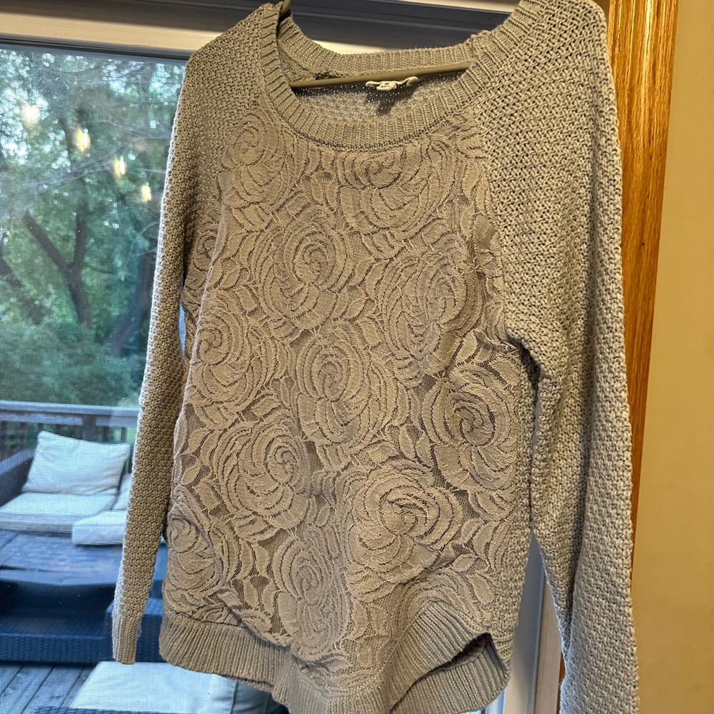 super cute sweater with floral accents